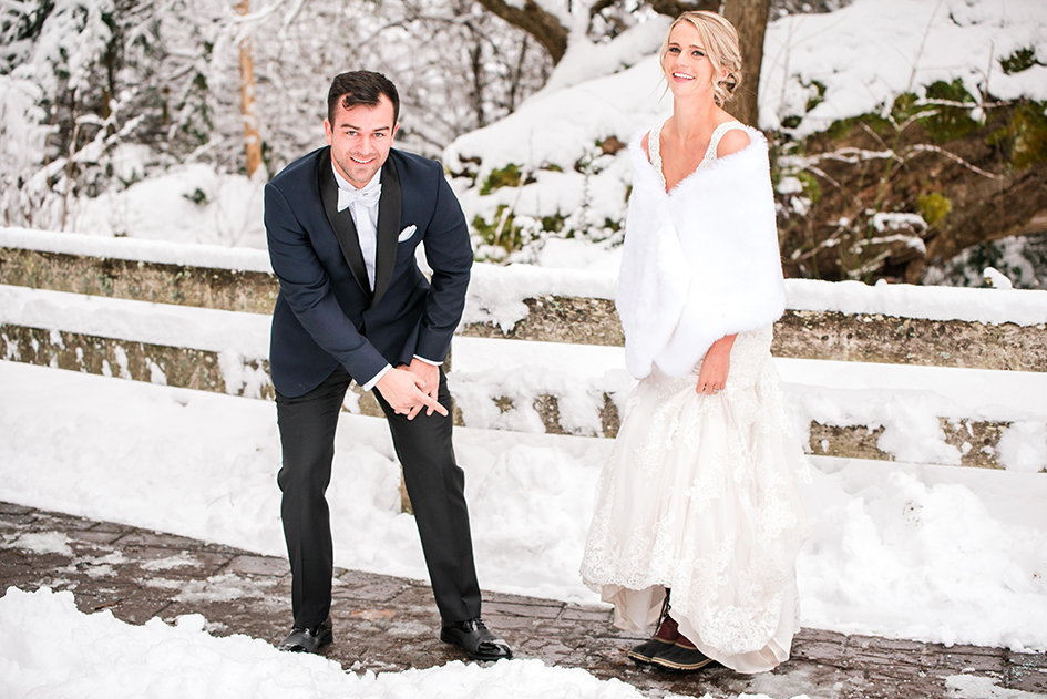 Jordan Schiemer points to his wife's feet, clad in boots underneath her wedding dress.