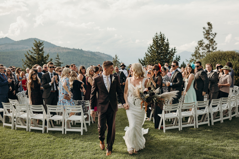 In the round ceremony with mountains in the background at Sun Mountain Lodge